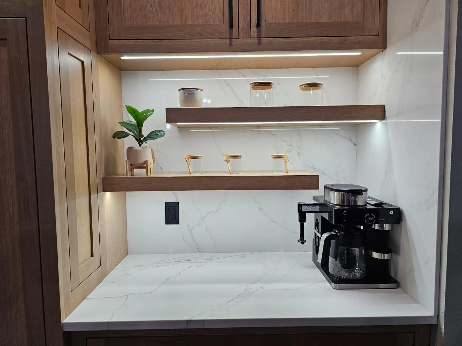 Custom built-in walnut butler's pantry with floating shelves by AT Cabinetry